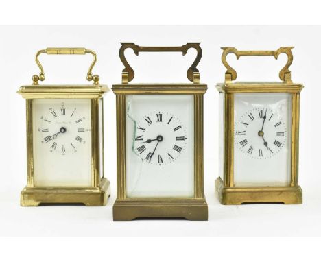 Three early 20th century brass cased &amp; glazed carriage clocks. The lot to include a London Clock Co. brass cased carriage