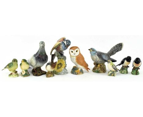 A collection of vintage Beswick porcelain figurines of birds and figurines. The lot to include a whitethroat, two greenfinche