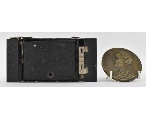 George Eastman (Kodak) Bronze medal presented to C G Whitlock for 25 years service with Kodak. Together with a Kodak fold out