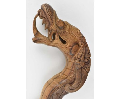 A 20th century Chinese hardwood carved cane walking stick in form of a dragon, with a dragon head pommel.Measures approx. 90c
