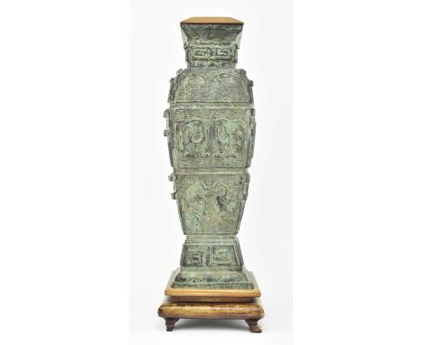 A vintage Chinese archaic style bronze lamp base. The bronze modelled in shape of Hu wine vessel, decorated with relief anima