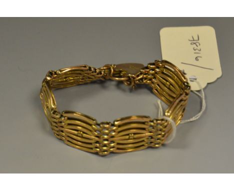 A 9ct seven bar gate bracelet, heart padlock, 24.3g