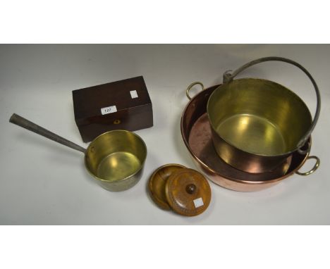 An early 20th century copper two-handled pan, rolled rim;  a brass jam pan;  a brass sauce pan;  a  19th  century mahogany te