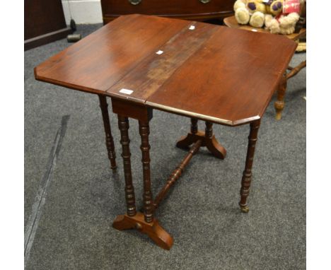 A Victorian mahogany gate leg Sutherland table, heavily turned supports, refrectory stretcher 