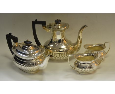 Silver Plated Ware - a four piece stop fluted tea service comprising of teapot, hot water jug milk jug and sucrier (4)