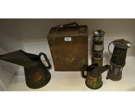 A J.H Naylor Wigan Miners lamp; another; a Shell- Mex oil can; a Castrol oil can; another 