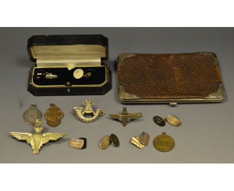 A pair of silver cufflinks;  a silver mounted leather wallet;   other cufflinks;   cap badges;  etc 