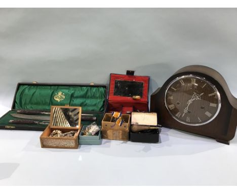 A carving set, mantle clock and medals etc.
