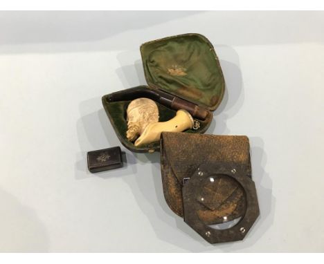 A Meerschaum pipe, a snuff box and a magnifying glass