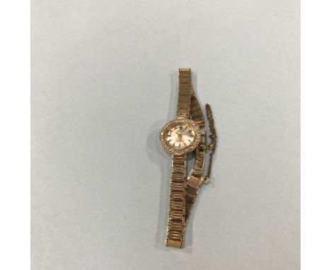 A ladies 9ct gold Rolex cocktail watch, with diamond bezel