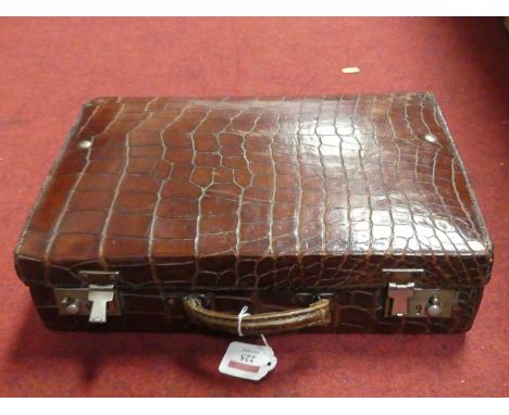 A vintage crocodile skin suitcase, width 37x24x10cmThe exterior is worn and marked especially on the corners.The interior is 