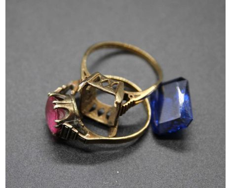 A 9ct gold synthetic sapphire set dress ring (stone loose) together with one other 9ct gold pink stone set dress ring, both a