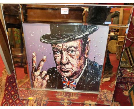 A contemporary print of Winston Churchill in bevelled mirror frame, full dimensions 55x55cm