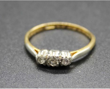 A vintage 18ct gold and platinum diamond three stone ring, 1.9g, size L