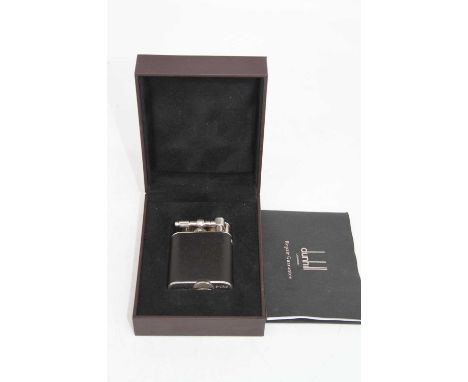A vintage Alfred Dunhill lighter, boxed with repair guaranteeWith two dents/chips to the plating on the hood of the chimney, 