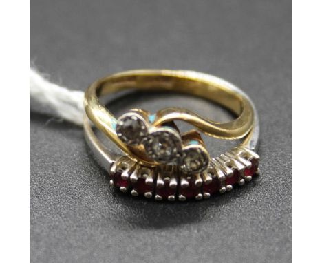 An 18ct gold and platinum diamond three stone ring, size G; together with an 18ct white gold and ruby set half hoop ring, siz