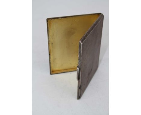 A George V silver pocket cigarette case having engine turned decoration and gilt washed interior, 7oz