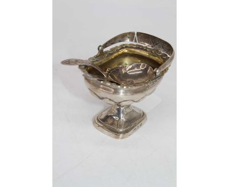 A George III silver caddy spoon, having a shell shaped bowl and bright cut engraved stem; together with another George III si