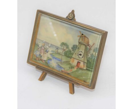 A 20th century novelty strut clock decorated with a Dutch river scene with windmill, height 9cmClock does not appear in worki