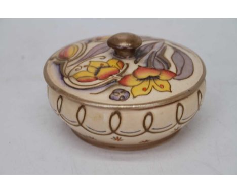 Charlotte Rhead for Burleigh ware an Art Deco powder pot and cover of squat circular form, tubeline decorated with flowers ha