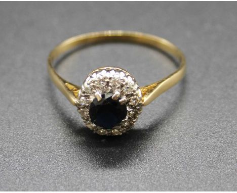 A yellow metal, sapphire and diamond cluster ring, marks rubbed but tests as approx 18ct, 3.7g, size W
