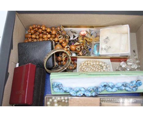 A collection of miscellaneous costume jewellery to include white metal brooch, enamelled lapel badges, hinge bangle, simulate
