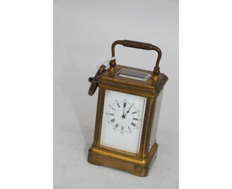 A lacquered brass carriage clock, the enamel dial showing Roman numerals, having visible platform escapement, height 8.5cm, w