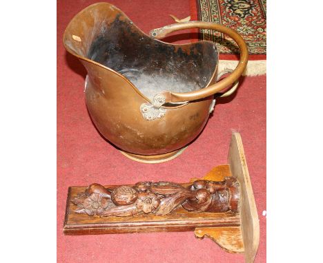 A Victorian copper coal scuttle; together with a carved oak wall bracket (2)