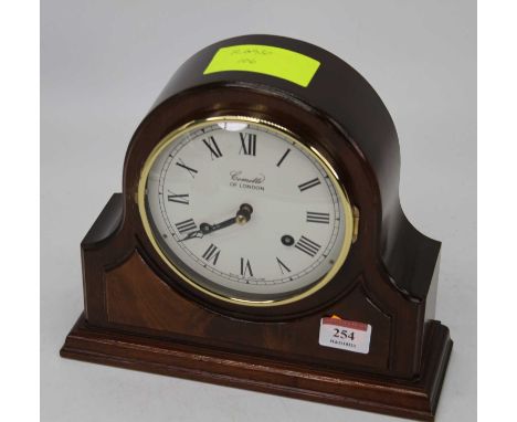 A modern mahogany cased mantel clock, the convex enamel dial with Roman numerals signed Comitti of London, having an eight da