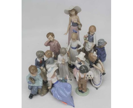 A collection of twelve Spanish porcelain figures to include NaoLargest lady with small chip to finger.All others appear free 