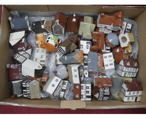 A collection of miniature ceramic models of cottages
