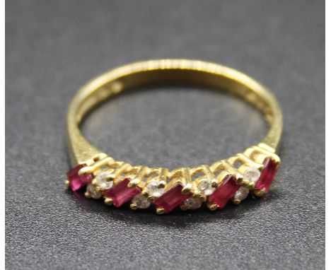 A modern 18ct gold, ruby and diamond half hoop ring, 2.7g, size P