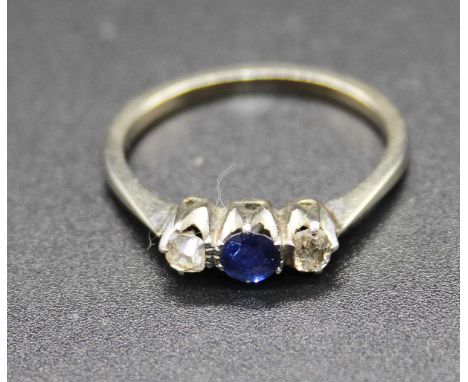 A white metal, sapphire and diamond three stone ring, tests as 9ct, 2.1g, size P