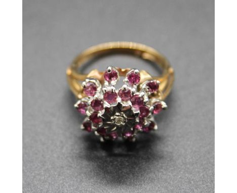 A modern 9ct gold, amethyst and diamond point flower head cluster ring, 4.8g, size L/M