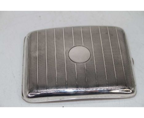 A large George V silver pocket cigarette case having engine turned decoration and vacant cartouche, 4.8oz