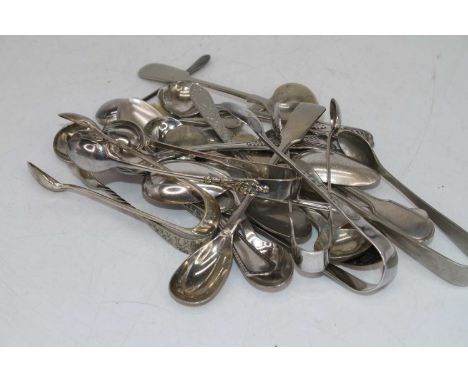 A collection of loose silver and white metal flatware, various dates and makers, principally being tea / preserves spoons and