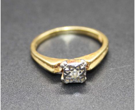 An 18ct gold diamond solitaire ring, the small round cut in a rubover setting, 3.4g, size K