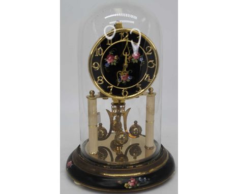 A 20th century brass anniversary clock, housed under a glass dome, height 30cm