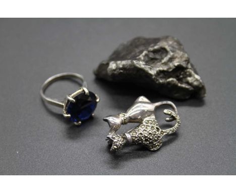 A silver and marcasite set pin brooch, together with a white metal and faux sapphire set dress ring, and a white metal rock s