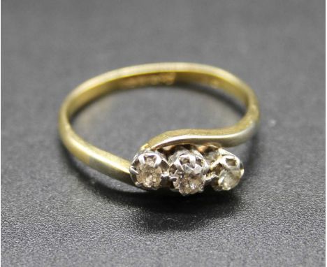 An 18ct gold diamond three stone ring, total diamond weight stated as 0.33ct, 2.8g, size O