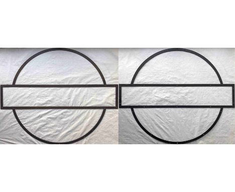 Pair of London Underground station ROUNDEL FRAMES, one in brass, one in alloy. These are the standard larger type, 51" x 42" 