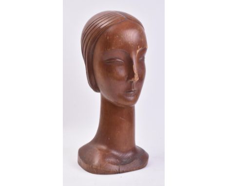 A vintage mid 20th century carved pine bust / shop display in the form of a lady's head. The head with carved detailed featur