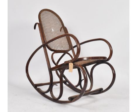 After Michael Thonet - A retro 20th century vintage Thonet style bentwood rocking / rocker chair having a woven rattan weave 