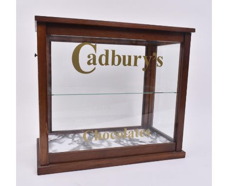 A vintage 20th century upcycled oak cased cabinet with Cadbury's Chocolates advertising to the front. Allround glass panels w