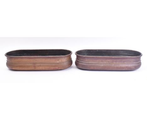 A pair of 19th century Italian copper planters. Each planter of rounded rectangular form with etched rope twist rims and furt