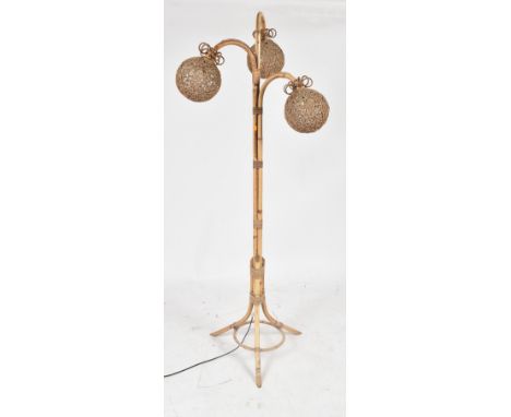 A retro mid 20th century Italian bamboo rattan floor standing lamp light. The lamp having three bent bamboo pendant arms with