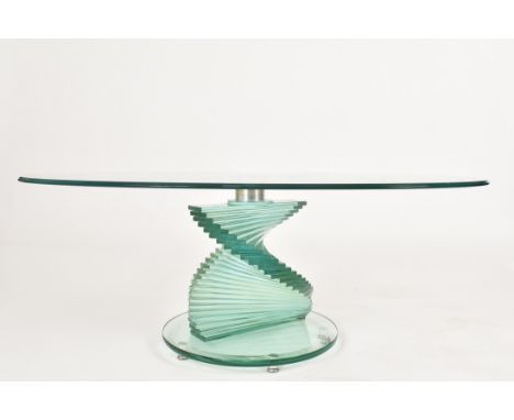 A contemporary high-end glass spiral coffee low occasional table. The table having an oval tempered glass top with screw in c