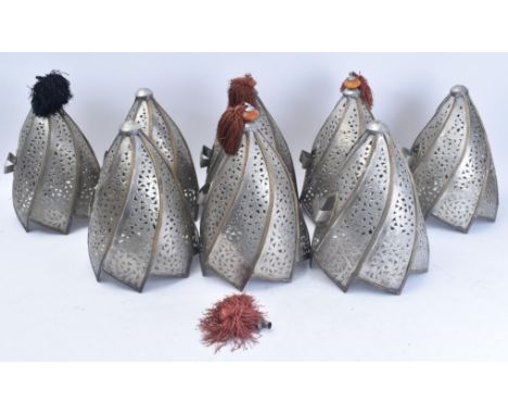 A set of eight late 20th century Moroccan aluminium &amp; brass wall hanging planters. Each planter with a shaped conical pie