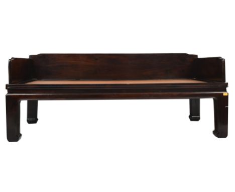 A large 20th century Chinese carved hardwood daybed with matching low stool / coffee table. The daybed of rectangular form ha