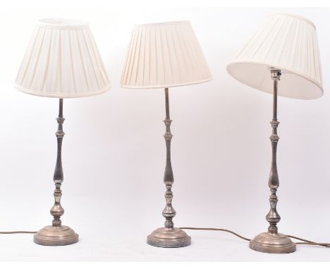 A set of three vintage 20th century nickel plated Art Deco style desk table lamps of graduating sizes. Each having a conical 